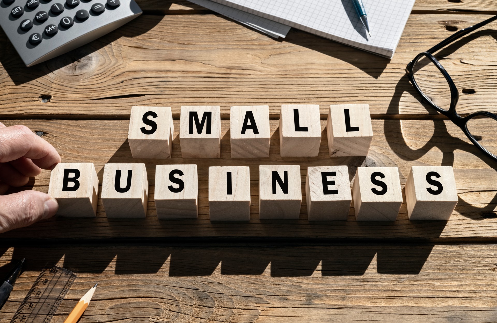 Small Business words on blocks SME and entrepreneur startup businesses concept